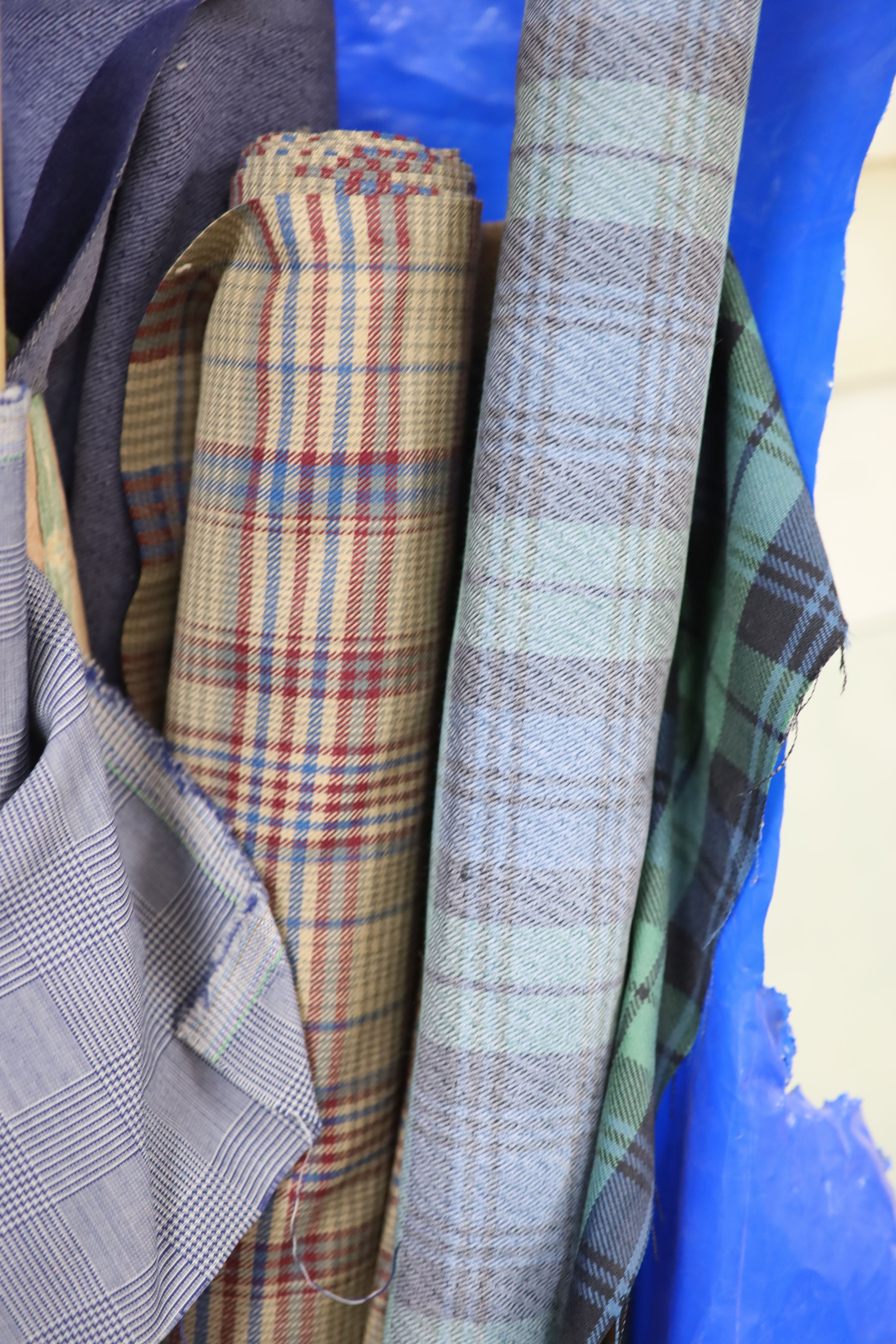 Various lengths of dress fabric including Scottish tartan